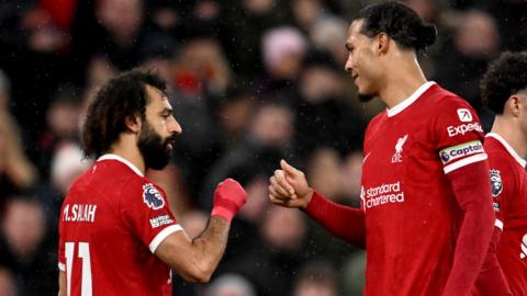 Mohamed Salah and Virgil Van Dijk celebrate as Liverpool score against Newcastle in the Premier League