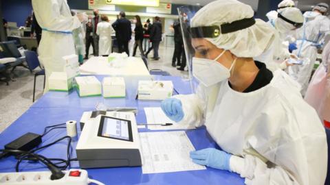 Medical personnel perform rapid Sars Cov-2 tests at Elmas Airport in Cagliari, Italy, 08 March 2021