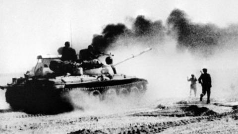 Iraqi troops riding in Soviet-made tanks trying to cross the Karun river, north-east of Khorramshahr in Iraq, during the Iran-Iraq war