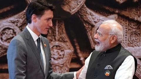 India's Prime Minister Narendra Modi (R) shakes hand with Canada's Prime Minister Justin Trudeau ahead of the G20 Leaders' Summit in New Delhi on September 9, 2023