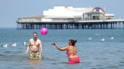 People in sea at Brighton