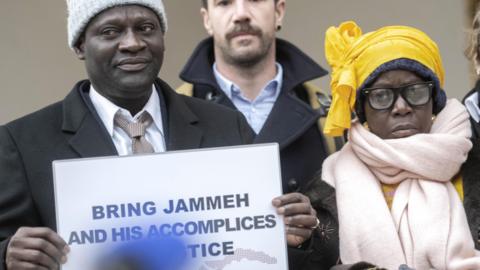 Victims and their relatives demonstrate in front of the Federal Criminal Court of Switzerland before the beginning of the trial against Gambia's former Interior Minister Ousman Sonko in Bellinzona, Switzerland, 08 January 2024.