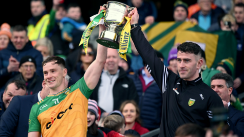 Ciarán Thompson and Patrick McBrearty lift the trophy for Donegal