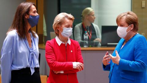 Belgium's Prime Minister Sophie Wilmes and European Commission President Ursula von der Leyen speak with Germany"s Chancellor Angela Merkel