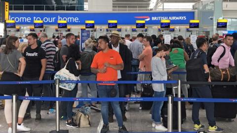 Queues in Terminal 5 at Heathrow airport as the UK"s biggest airport has apologised after extreme weather conditions across Europe caused flight cancellations and delays.