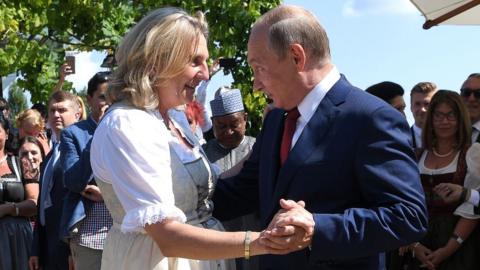 Austria's former foreign minister Karin Kneissl dances with Russia's President Vladimir Putin at her wedding in 2018.