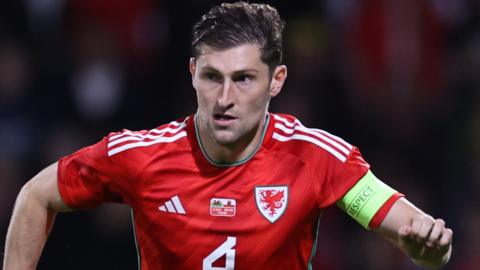 Ben Davies in action for Wales