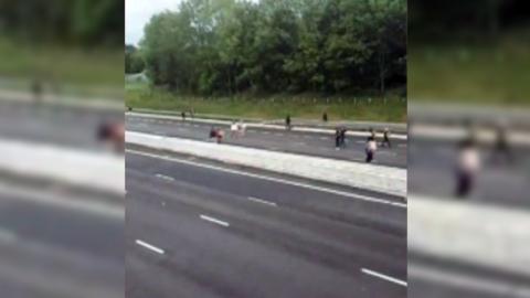 People walking on the M6