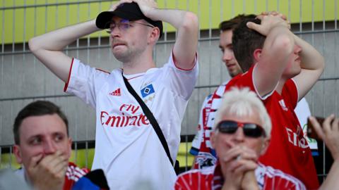 Hamburg supporters look dejected at full-time