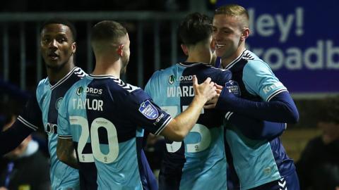 Wycombe celebrate their first goal against West Ham