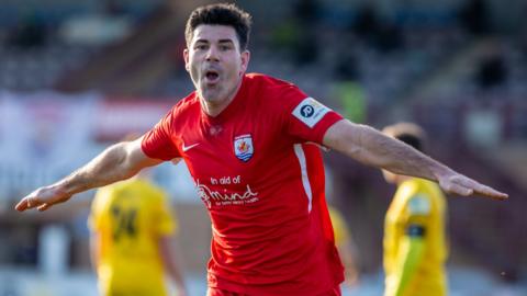 Mike Wilde celebrates his winner for Connah's Quay