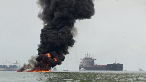 Large oil spill ignites off the coast of Borneo