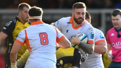 Luke Crosbie of Edinburgh is tackled by Ollie Griffiths of Dragons