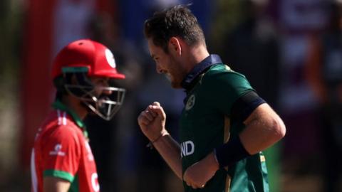 Oman's Jatinder Singh and Ireland's Mark Adair during the World Cup qualifier in Bulawayo