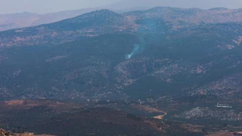 Smoke rises in Kfar Shouba, as seen from the village of Khiam, southern Lebanon, near the border with Israel (6 July 2023)