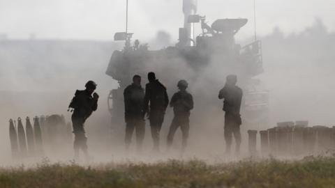 Israeli soldiers at the border with Gaza