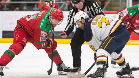 Cardiff Devils' Jamie Arniel and Matt Alvaro of Guildford Flames face-off at the Vindico Arena