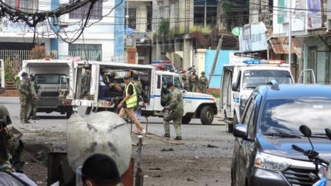 Filipino soldiers are pictured on the site of an explosion in Jolo Island, Sulu province, Philippines