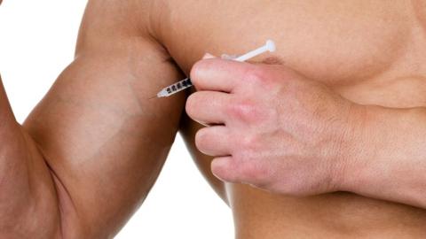 Man injecting himself with a steroid