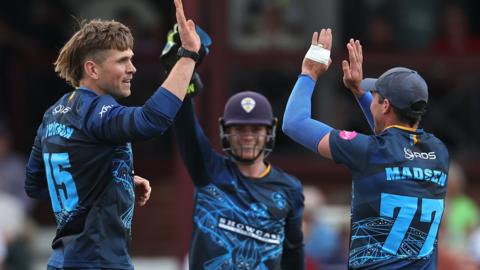 Derbyshire celebrate taking a wicket