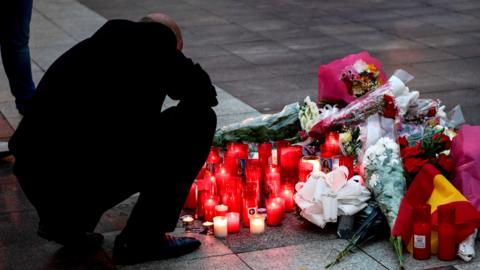 Flowers are laid in Algeciras after a verger is killed