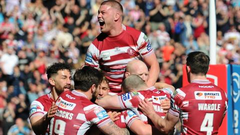Morgan Smithies roars with delight as Wigan celebrate Harry Smith's early try against St Helens