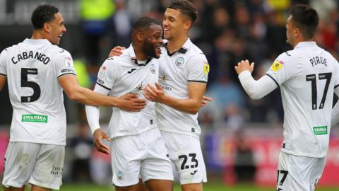 Swansea players celebrate during their win over West Brom on the final day of last season