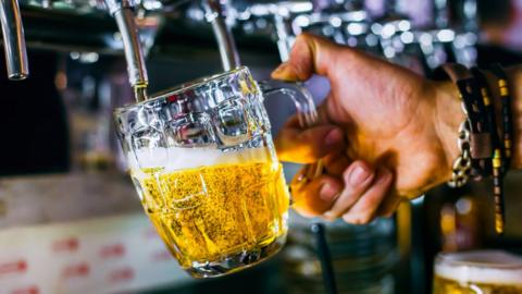 Pint of beer being poured