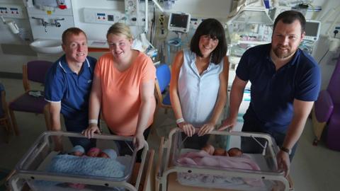 The McMenamins and the Stewarts with their triplets