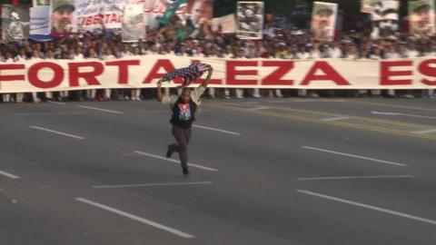 A man ran through Revolution Square in protest before being bundled to the ground and led away.