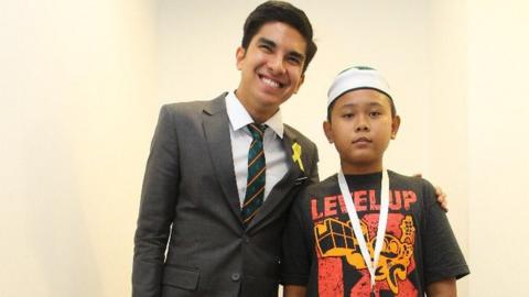 Youth Minister Syed Saddiq with Muhammad Thaqif