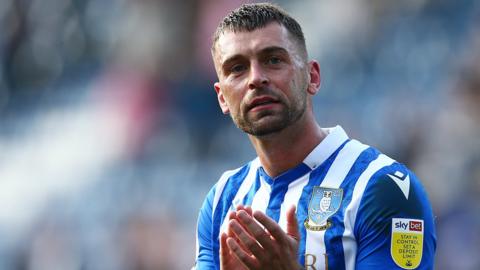 Jack Hunt of Sheffield Wednesday applauds fans following their match in League One 2022-23.