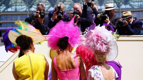 Racegoers have their picture taken during day three of Royal Ascot at Ascot Racecourse. Thursday June 16, 2022.