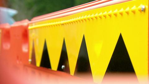 High-contrast roadwork fencing fitted with an iBeacon to provide warnings for partially sighted and blind pedestrians
