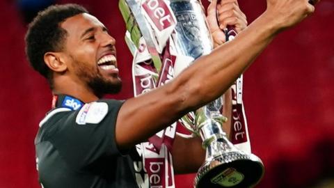 Vadaine Oliver takes a selfie following Northampton's League Two play-off final win