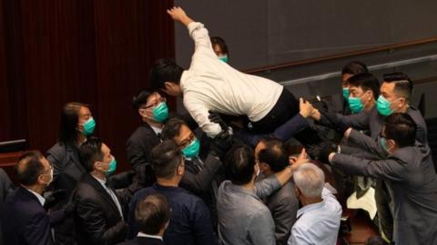 Ted Hui caught in mid-air during protests