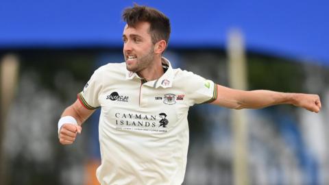 Gloucestershire bowler Matt Taylor celebrates a wicket