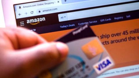 Visa card and Amazon website