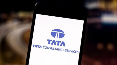 In this photo illustration the Tata Consultancy Services Limited logo is seen displayed on a smartphone.