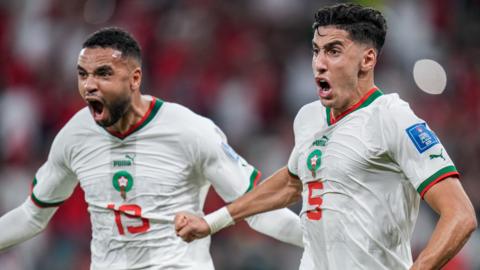 Morocco players celebrate scoring against Belgium