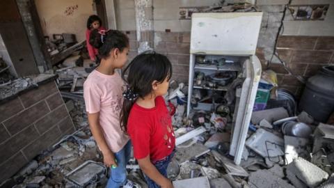 girls in destroyed house, Gaza