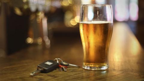 Beer and car keys on a table