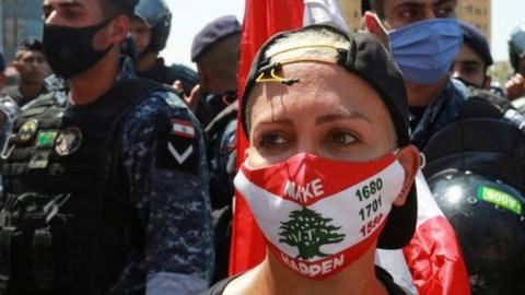 Lebanese woman wearing a facemask during a protest in Beirut (12/08/21)