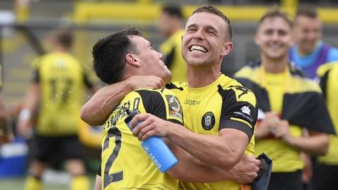 Harrogate players celebrate victory against Boreham Wood