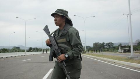 A Venezuelan army member stands guard at the entrance of the Tienditas cross-border bridge between Colombia and Venezuela in Tienditas, Venezuela, February 8, 2019.
