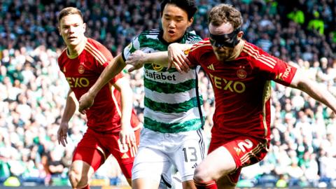 Aberdeen's Nicky Devlin and Celtic's Celtic Yang Hyun-Jun