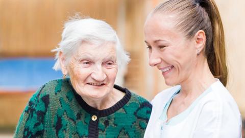 elderly person with nurse