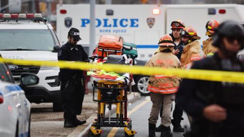 2: Police and emergency responders gather at the site of a reported shooting of multiple people outside of the 36 St subway station on April 12, 2022 in the Brooklyn borough of New York City.