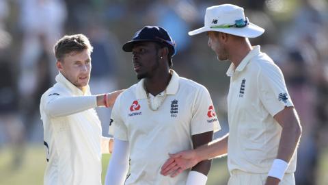 England captain Joe Root (left) and Stuart Broad (right) console Jofra Archer (centre) after the end of play on day three of the first Test against New Zealand