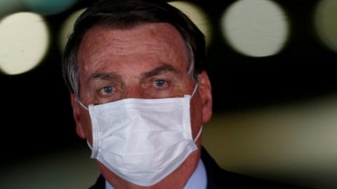 Brazil's President Jair Bolsonaro looks on during a press statement at the Alvorada Palace in Brasilia, Brazil August 12, 2020.